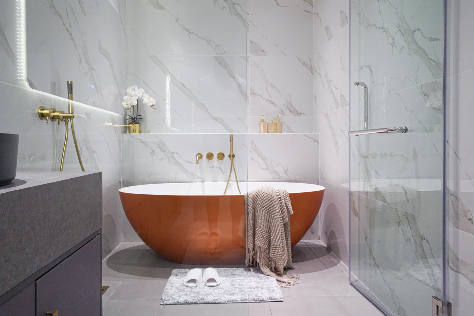 Copper tubs in Indigo. Dual-basin marble in Cerulean.