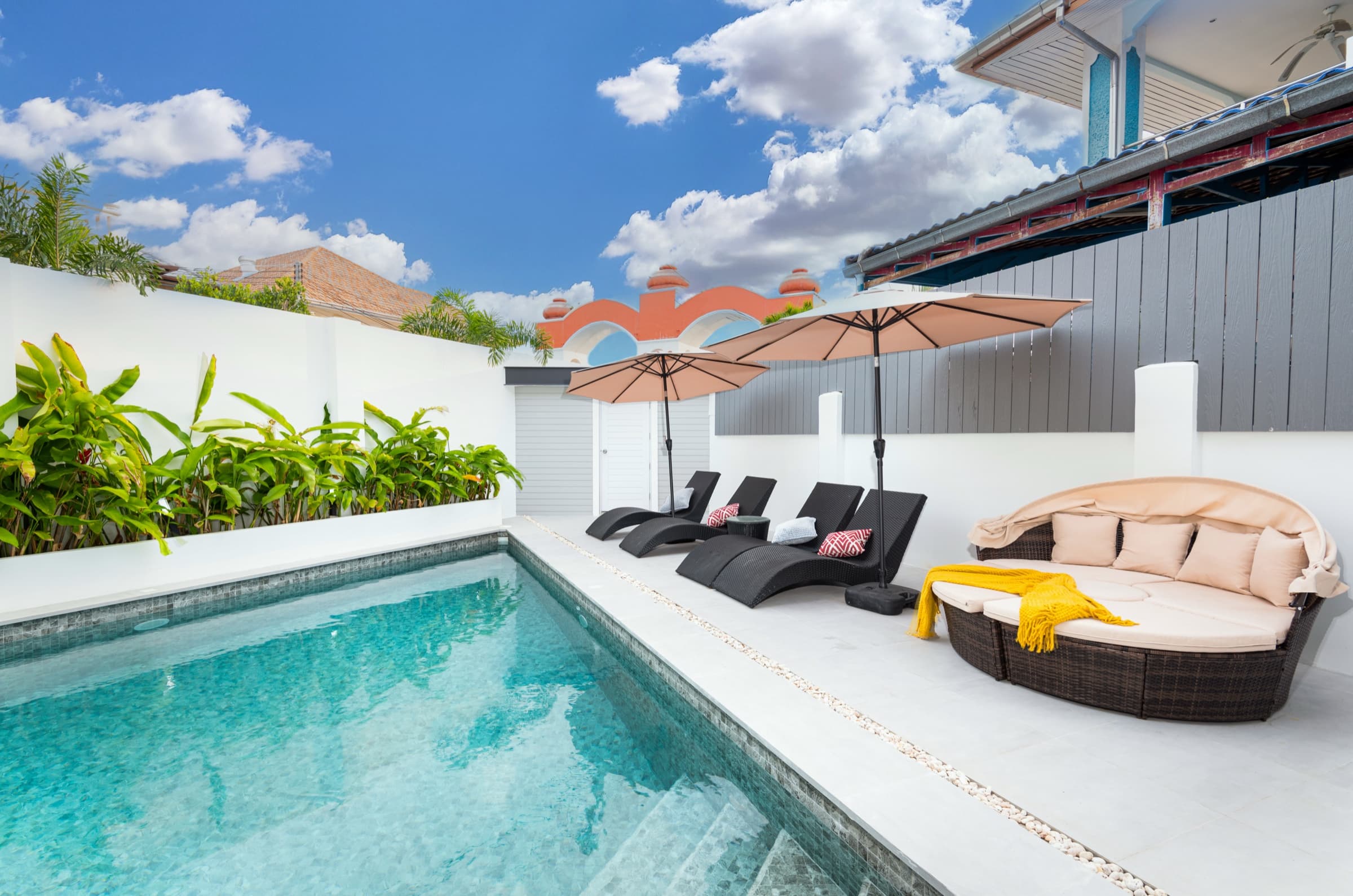Evening light over the walled pool terrace at Villa Azure in Jomtien, Pattaya — minutes from the Jomtien Beach Road night strip.